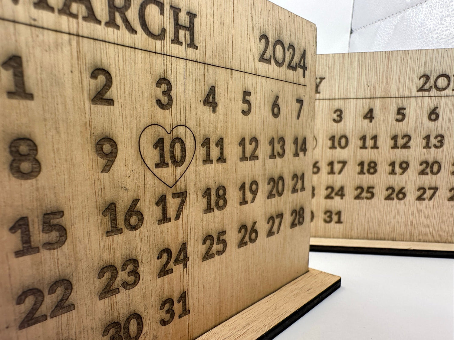 personalised home decor items: candles, signs and cups.