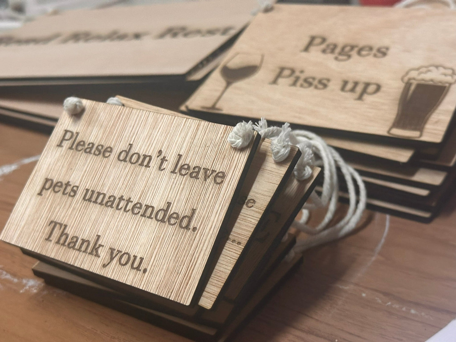 engraved wooden sign on a string