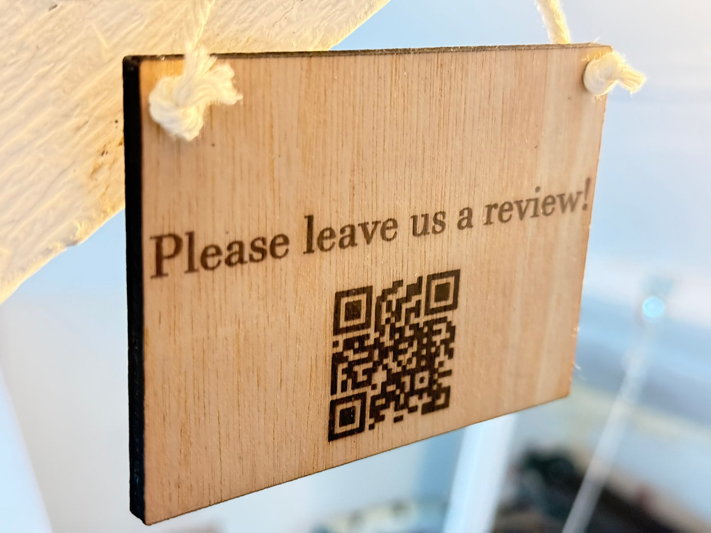 Engraved wooden oak veneer sign with custom text, logo or QR code, displayed on a white natural rope loop against a clean neutral background