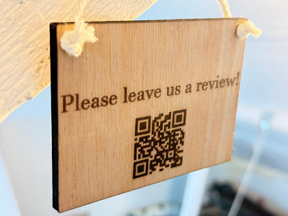 Engraved wooden oak veneer sign with custom text, logo or QR code, displayed on a white natural rope loop against a clean neutral background