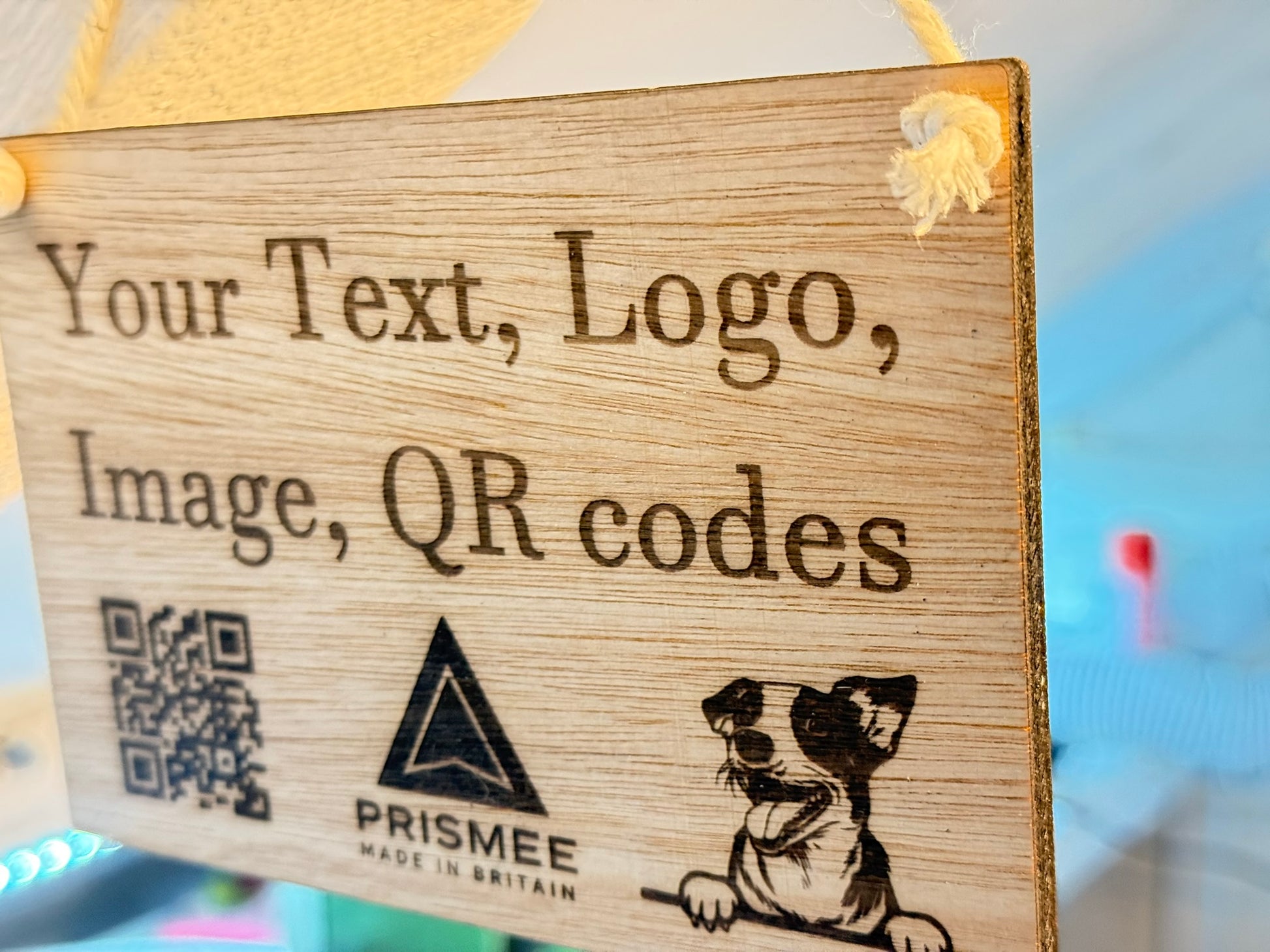 Engraved wooden oak veneer sign with custom text, logo or QR code, displayed on a white natural rope loop against a clean neutral background