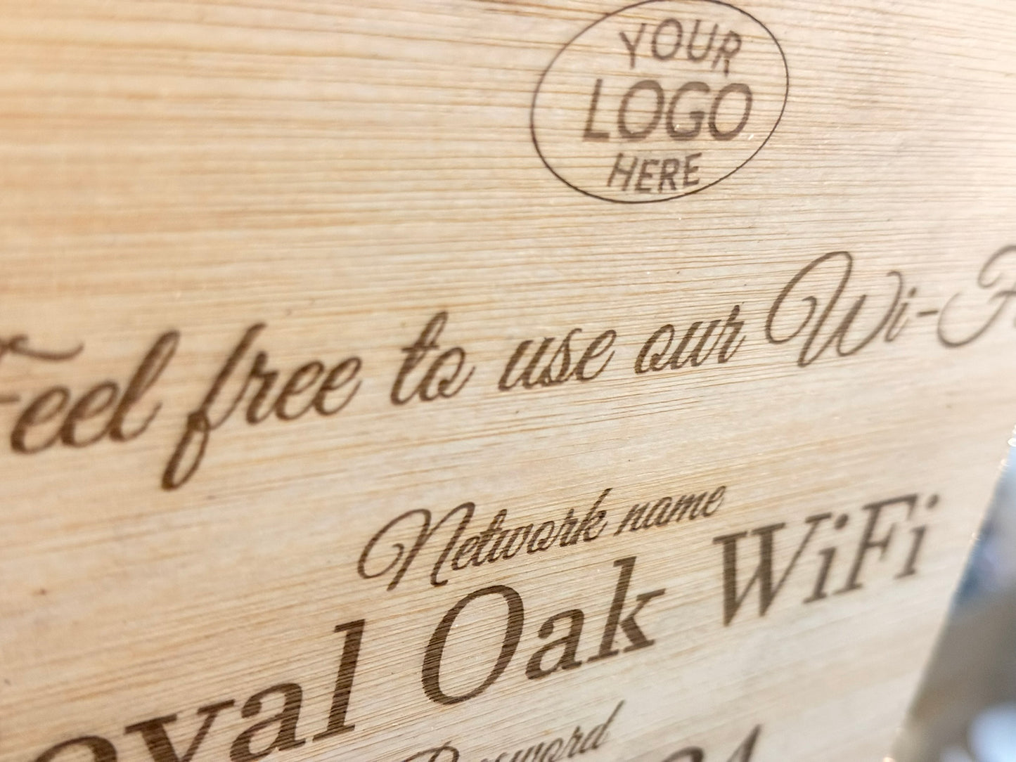 Wooden sign with 'Royal Oak WiFi' branding and space for a logo.