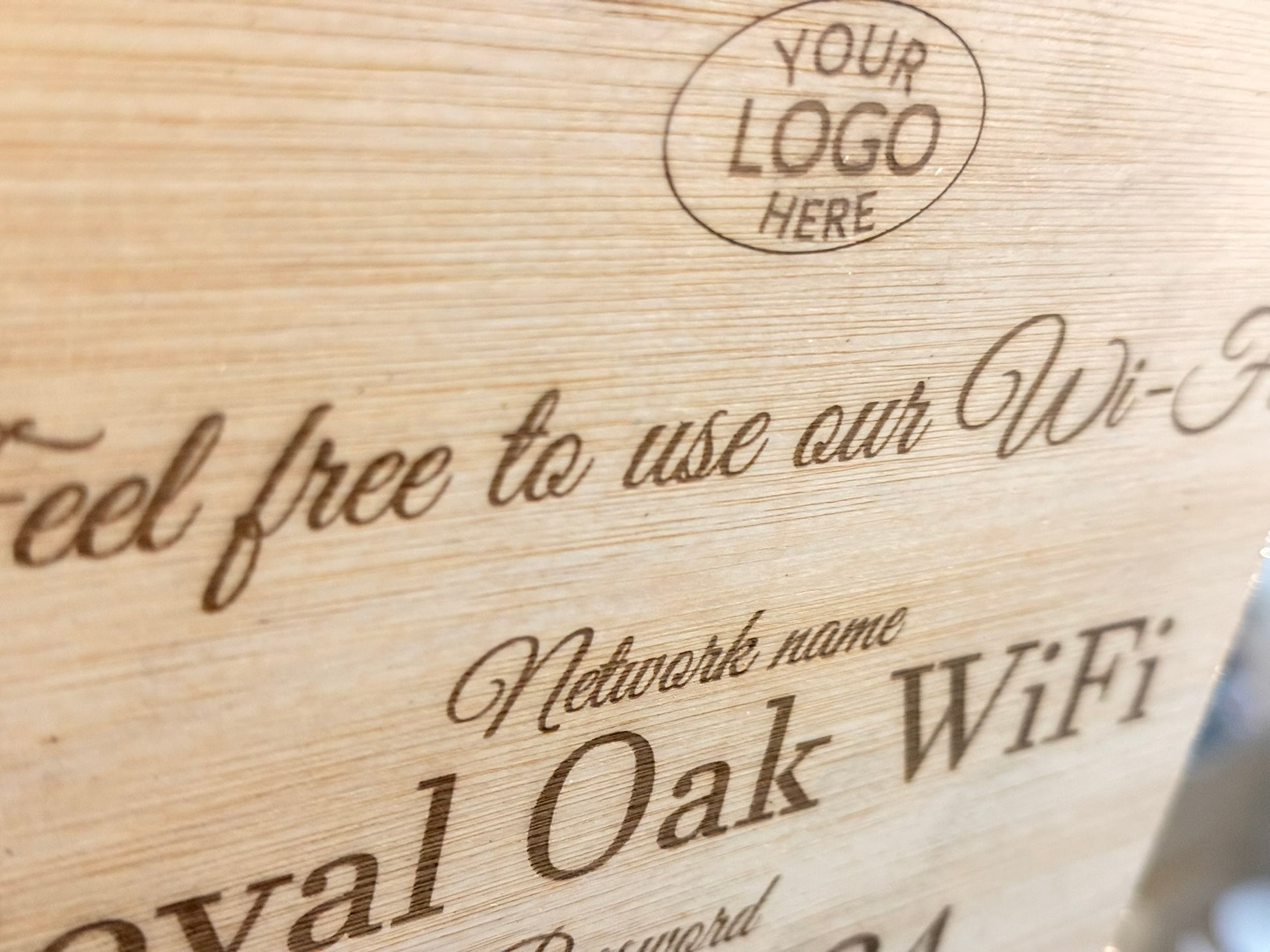 Wooden sign with 'Royal Oak WiFi' branding and space for a logo.